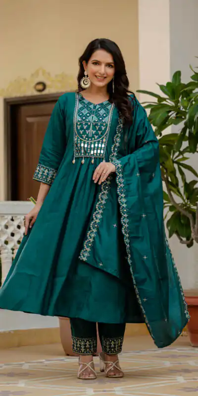 DIVA 126 Teal Viscose Roman Silk Anarkali Suit with Mirror Work & Embroidery Work. Affordable Price βΉ2049. Delivery 4-6 Working Days. Shop now. | Anarkali Suits, Bollywood Anarkali, Creative-Anarkali, Designer Anarkali, Embroidered Anarkali, Party Wear Anarkali