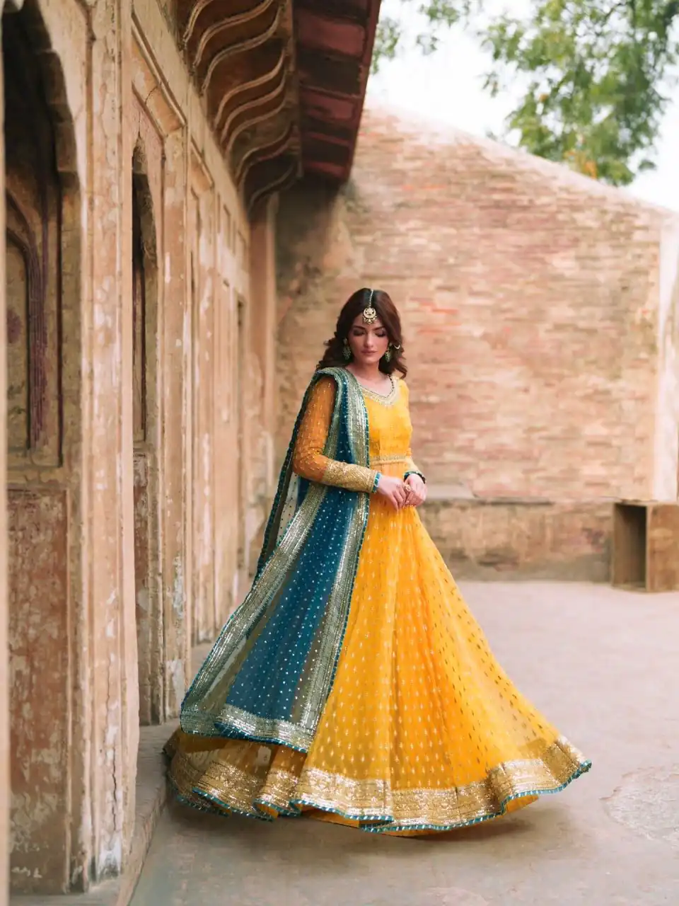 Stunning Yellow Soft Net Gotta Sequence Work Gown