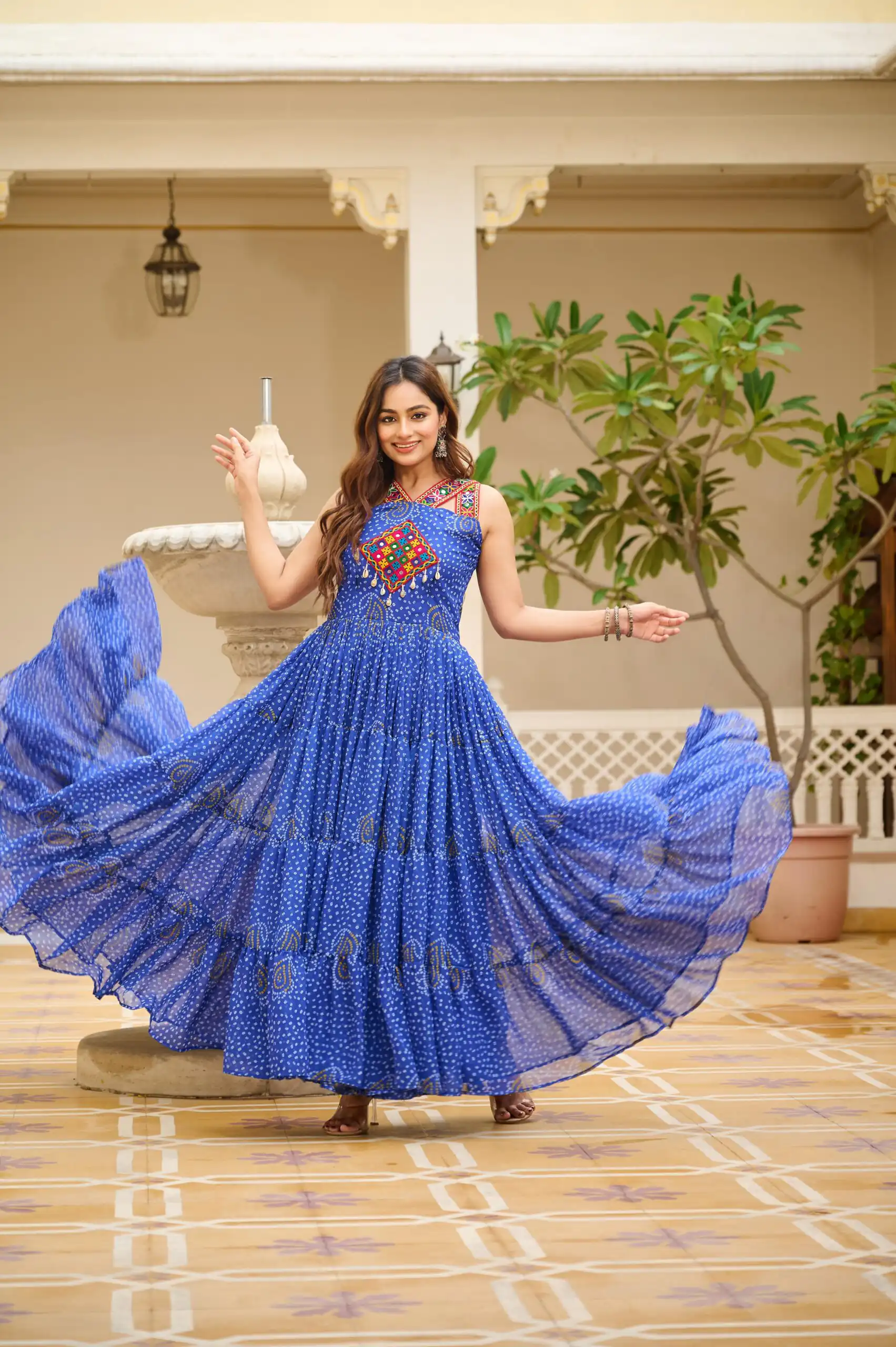 Graceful Blue Georgette Bandhni Print Mirror Work Gown